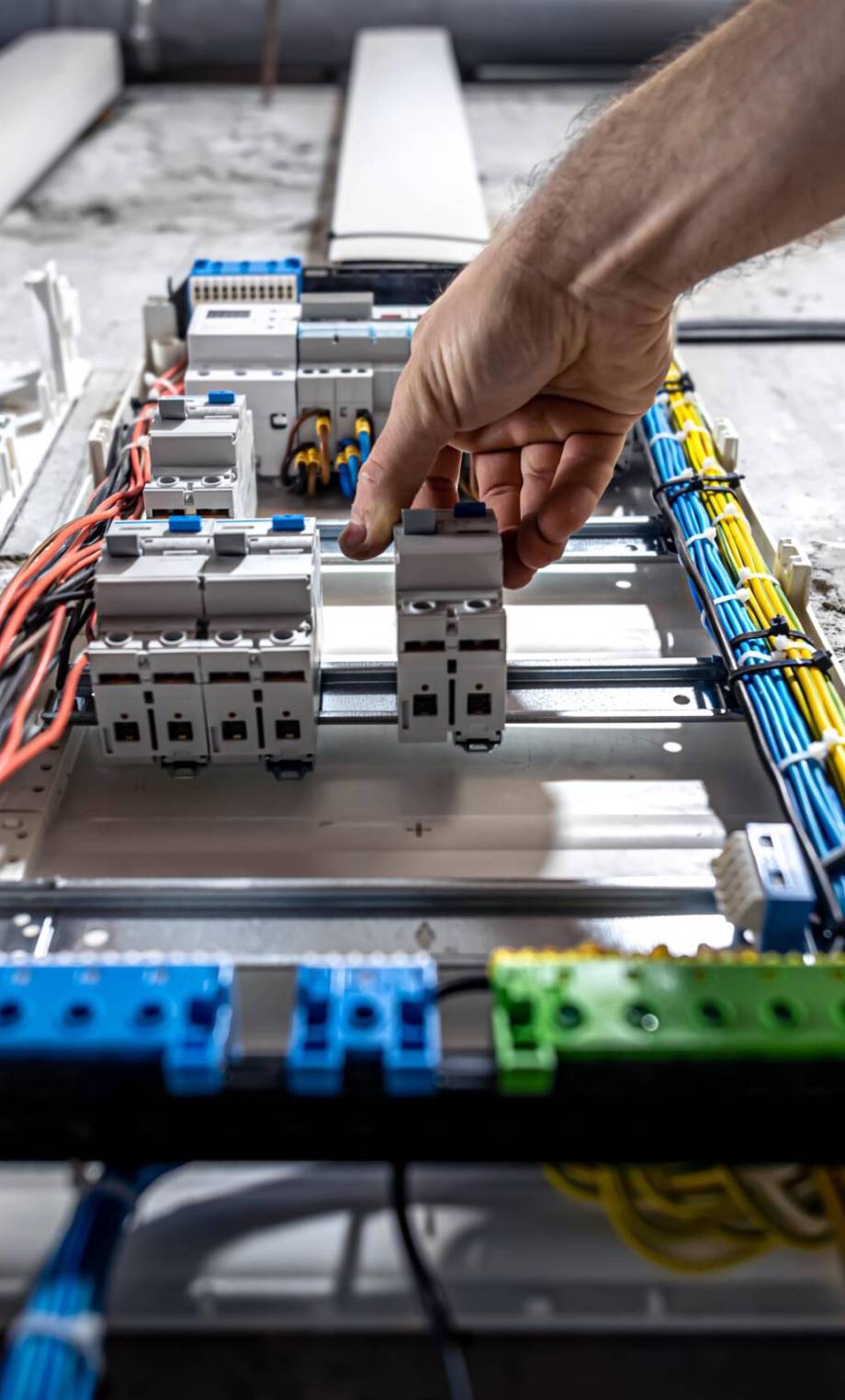 Voltage switchboard with circuit breakers are in the ON and OF positions in the big electric box for electrical distribution panel, and temporary electric cables are switched.